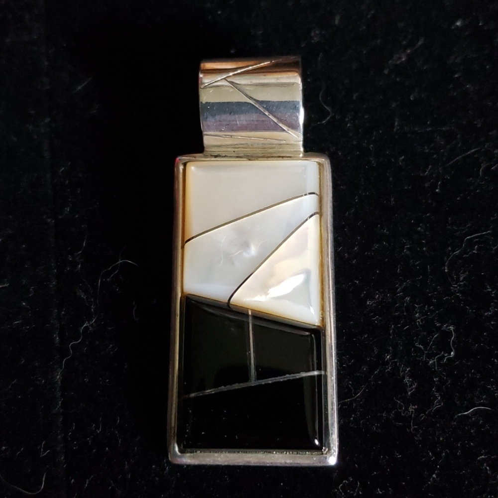 Onyx and mother of pearl pendant.